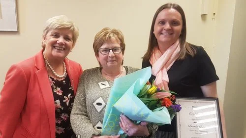 Bernie Burns (centre) on her retirement with Denise McNally, Housing Executive (left) and Siobhan ONeill, Supporting Communities (right).