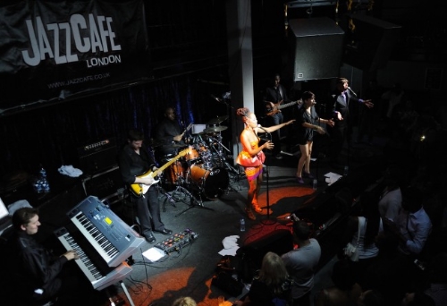 Deborah on stage with 3rd Logic, keyboardist Eli Staples and unknown backing vocalists. 