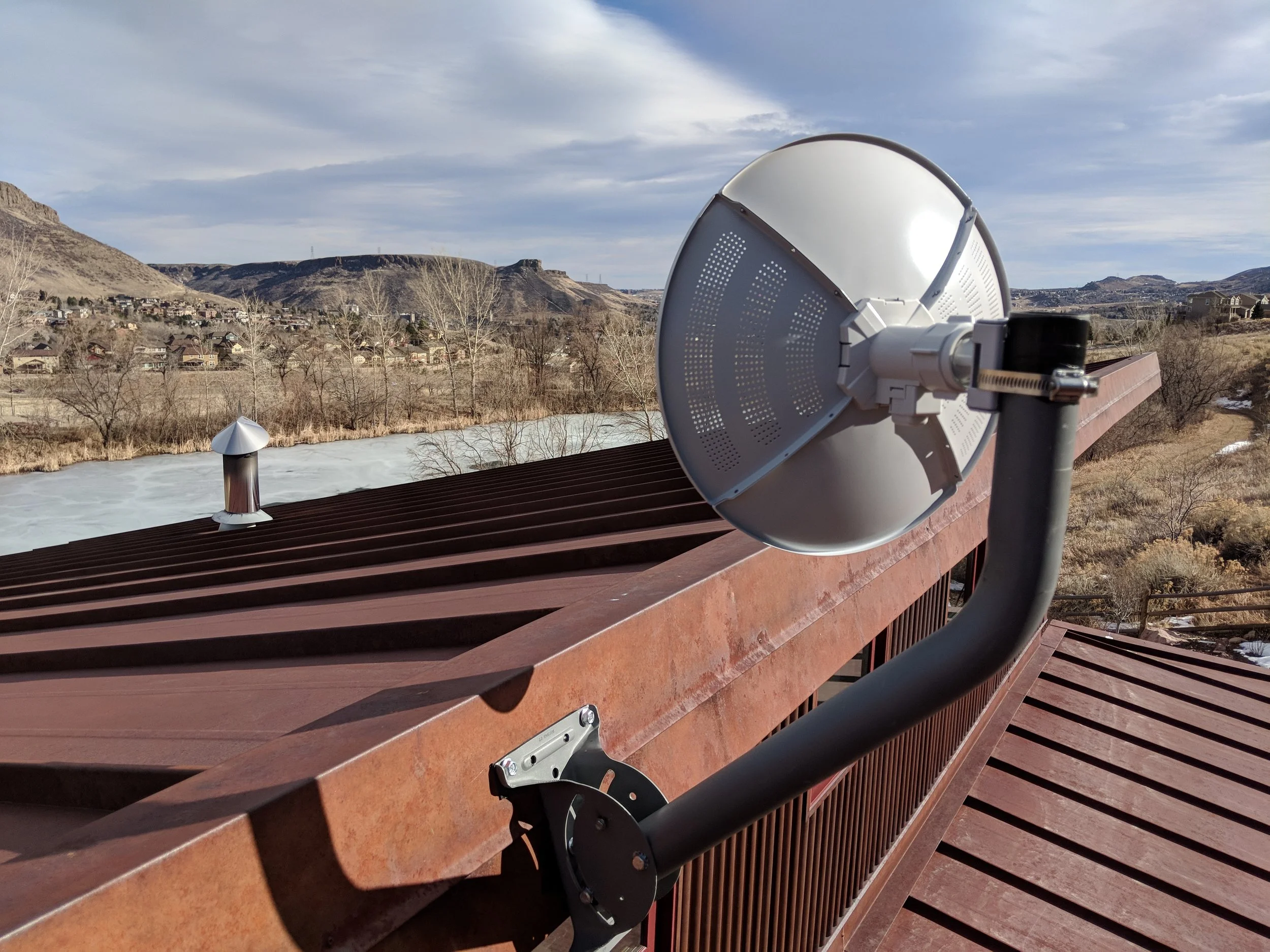 A smaller dish mounted to a j-bar