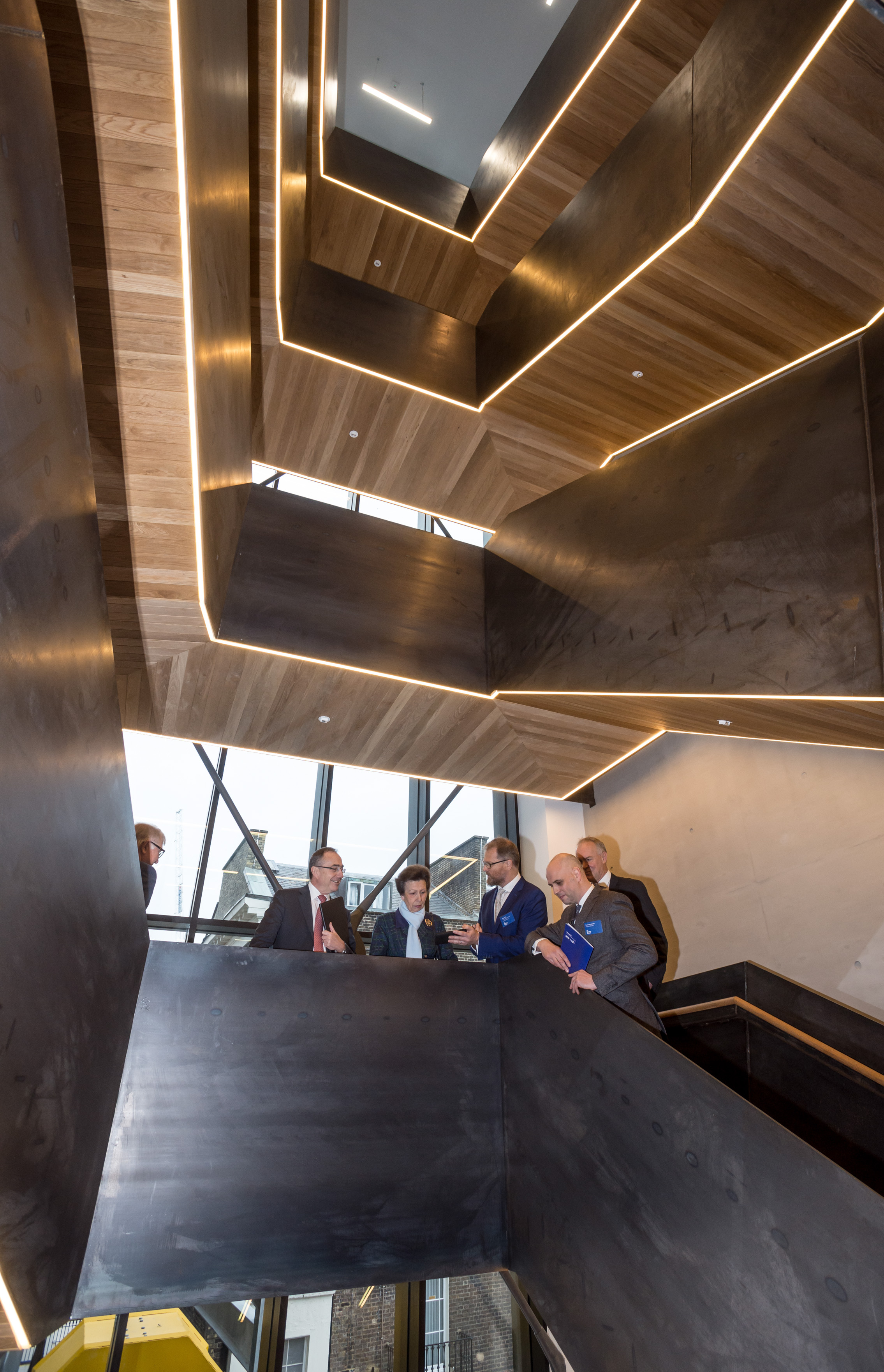  HRH Princess Anne is shown the six story staircase by Prof. Bob Sheil (head of School) Euan MacDonald (Architect Hawkins/Brown) Prof. Alan Penn (Dean) and Prof. Michael Arthur (Provost UCL) while touring the building before officially opening the re