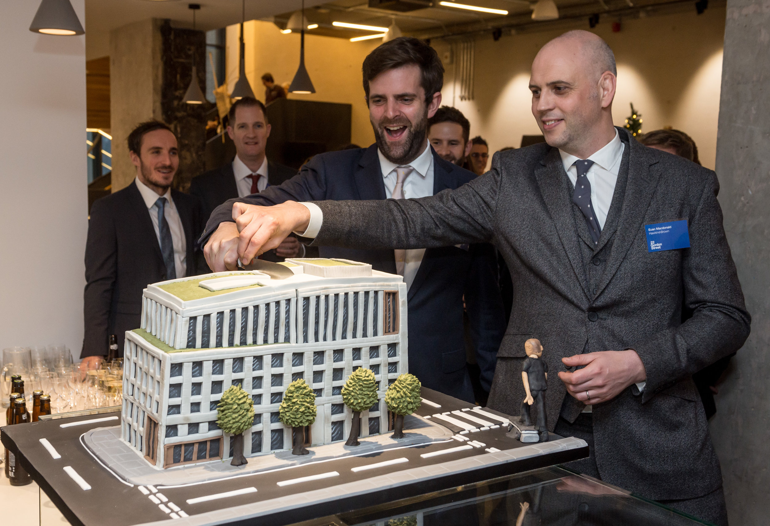  Euan MacDonald and Tom Noonan (Architects Hawkins/Brown) cut a cake version of the building during the official opening reception at the refurbished  Bartlett School of Architecture, 22 Gordon Street. London 
Hawkins/Brown architects 