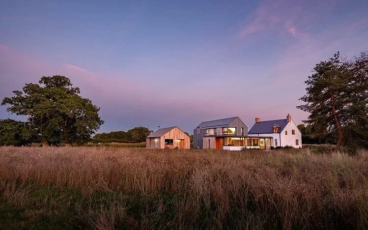 Exterior evening residential architectural photograph of Crick House with extension by architectural photographer