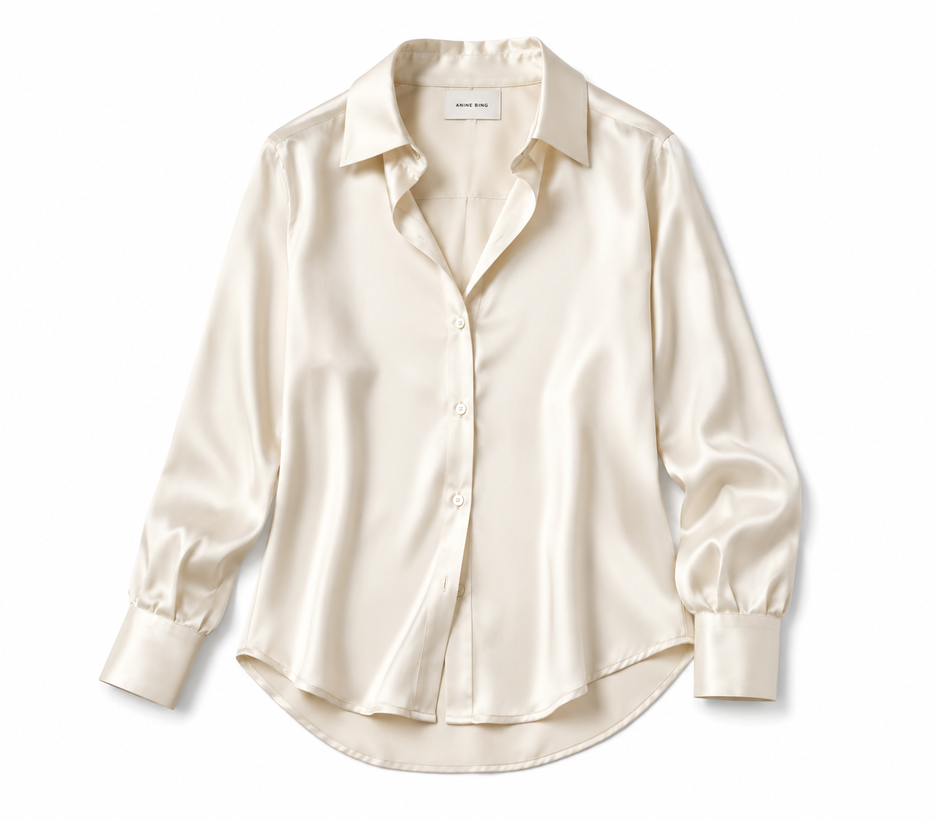 A cream-colored satin button-up shirt with a collar, long sleeves, and cuffs, displayed against a white background. /  E-Commerce Flat-Lay