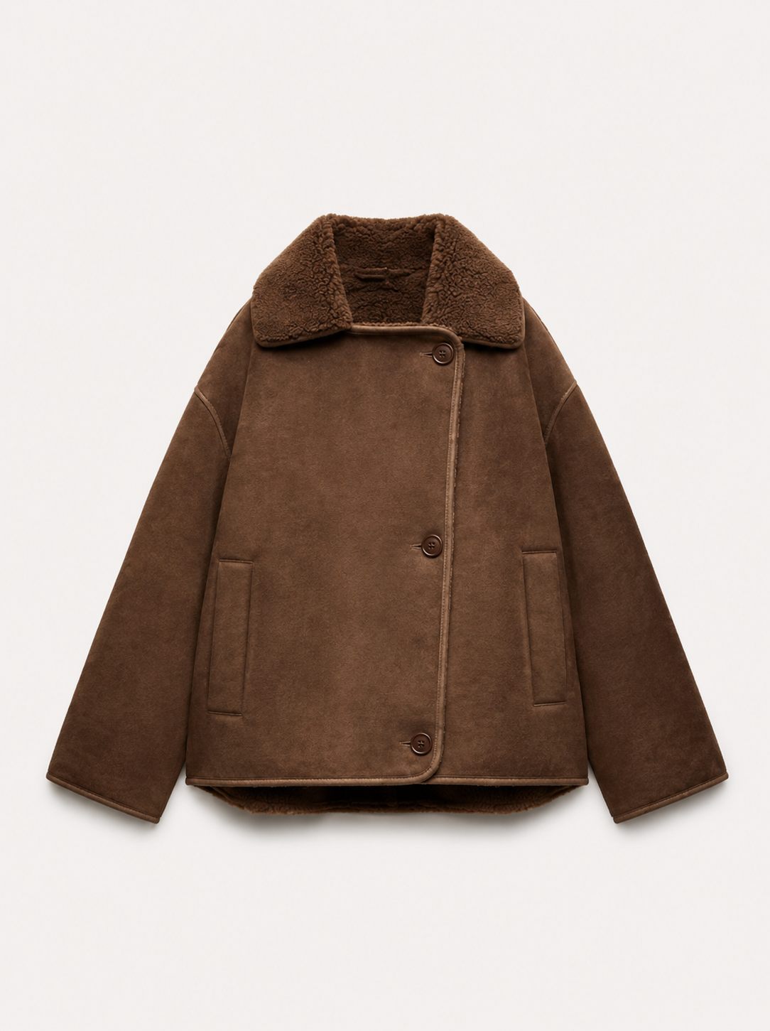 Brown shearling-lined coat with a wide collar, button closure, and two front pockets, placed against a plain background.