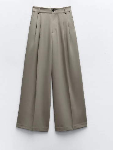 Beige wide-leg dress pants with pleats and belt loops. /  E-Commerce Flat-Lay