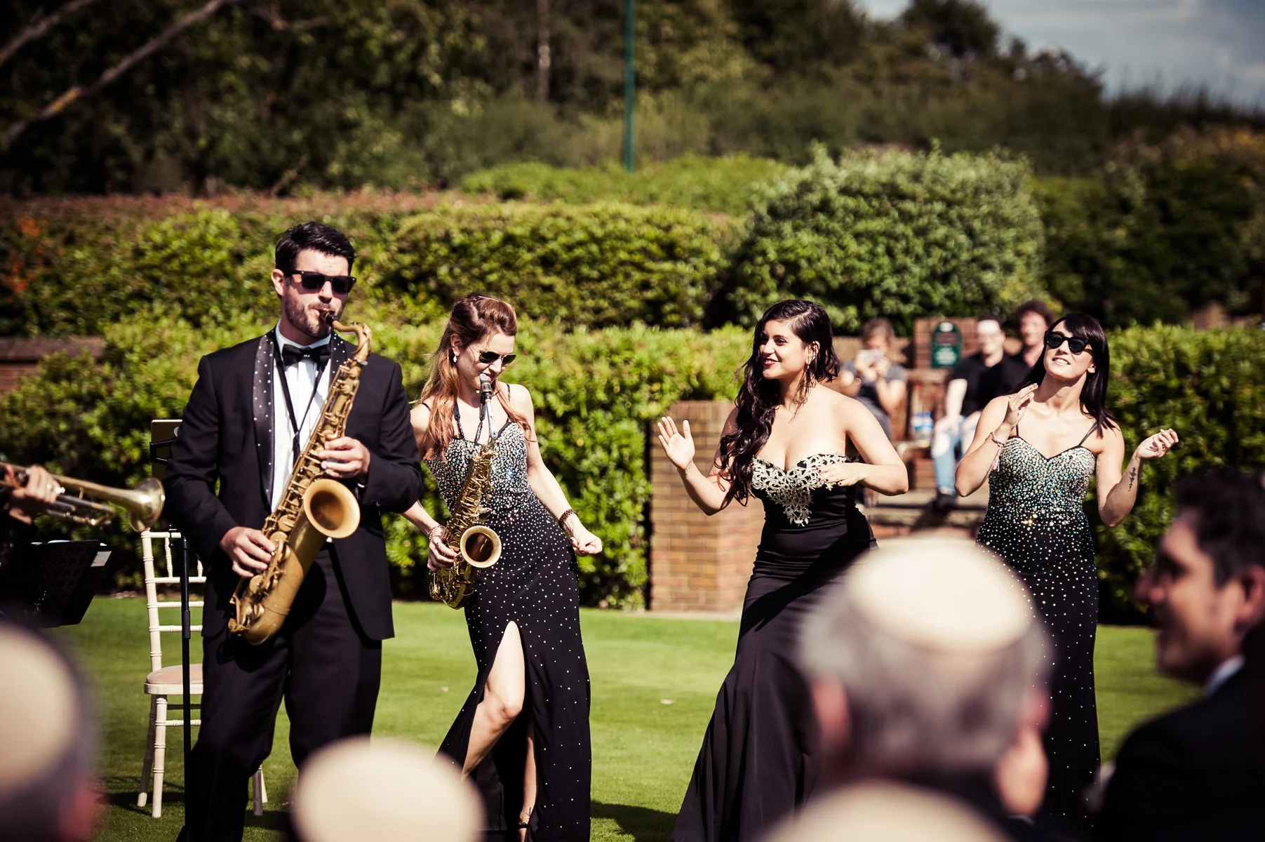 Sax Player and Singers on Lawn