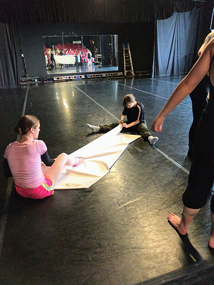 dance students working with props before performance.jpg