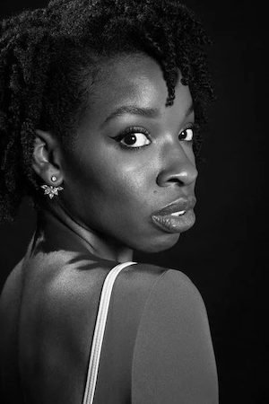   Jazmine C. Rutherford  received her training at Cincinnati Ballet and received her B.F.A. in Ballet Performance from The University of Cincinnati— College-Conservatory of Music (CCM). She is a recipient of the OhioDance Most Outstanding Student Awa