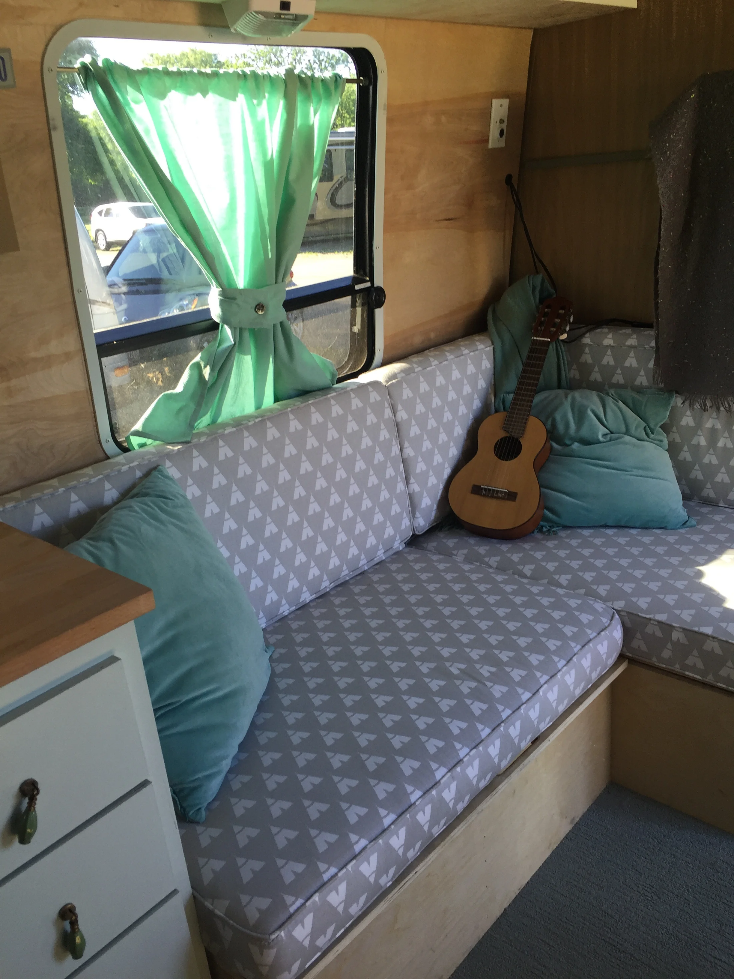 Not tacky teepee fabric. This pulls out and Jane and Henry sleep on it. The girls have a bunk bed in the back room, and we have a queen bed in the front. With a door. 