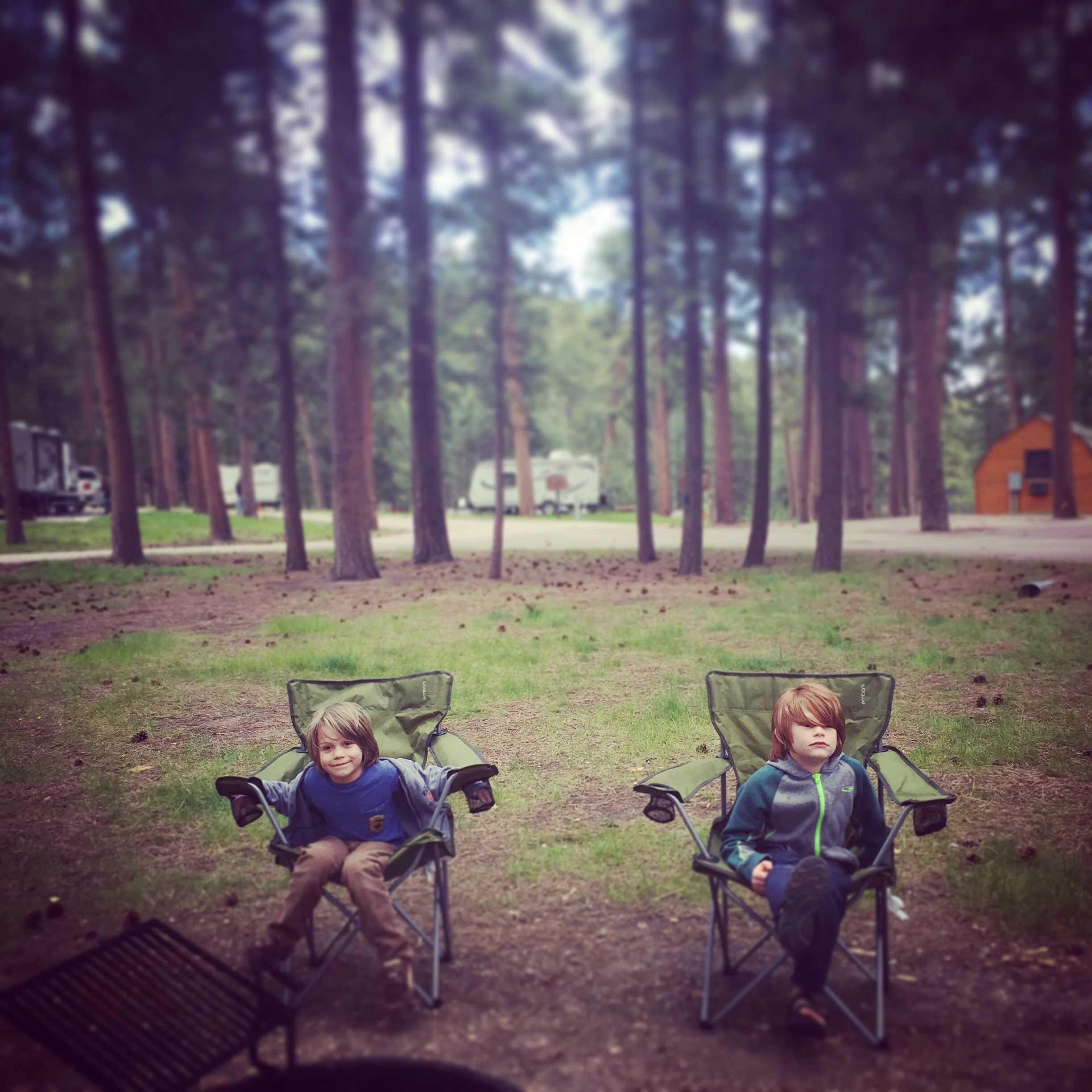 These boys look like they're having fun, but they've been told to sit here and not touch each other.
