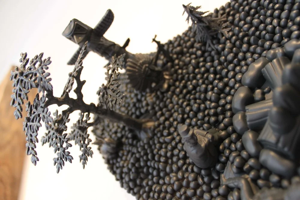 21"h x 32"w. corn, toys, and spray paint on wood. 2015.