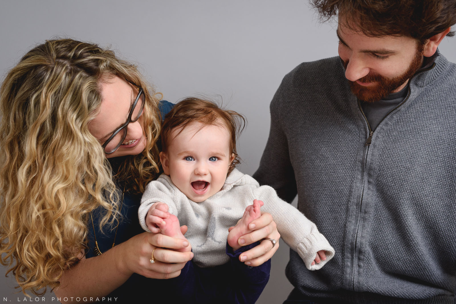 Singing and playing. Family photo session by N. Lalor Photography. Studio located in Greenwich Connecticut.