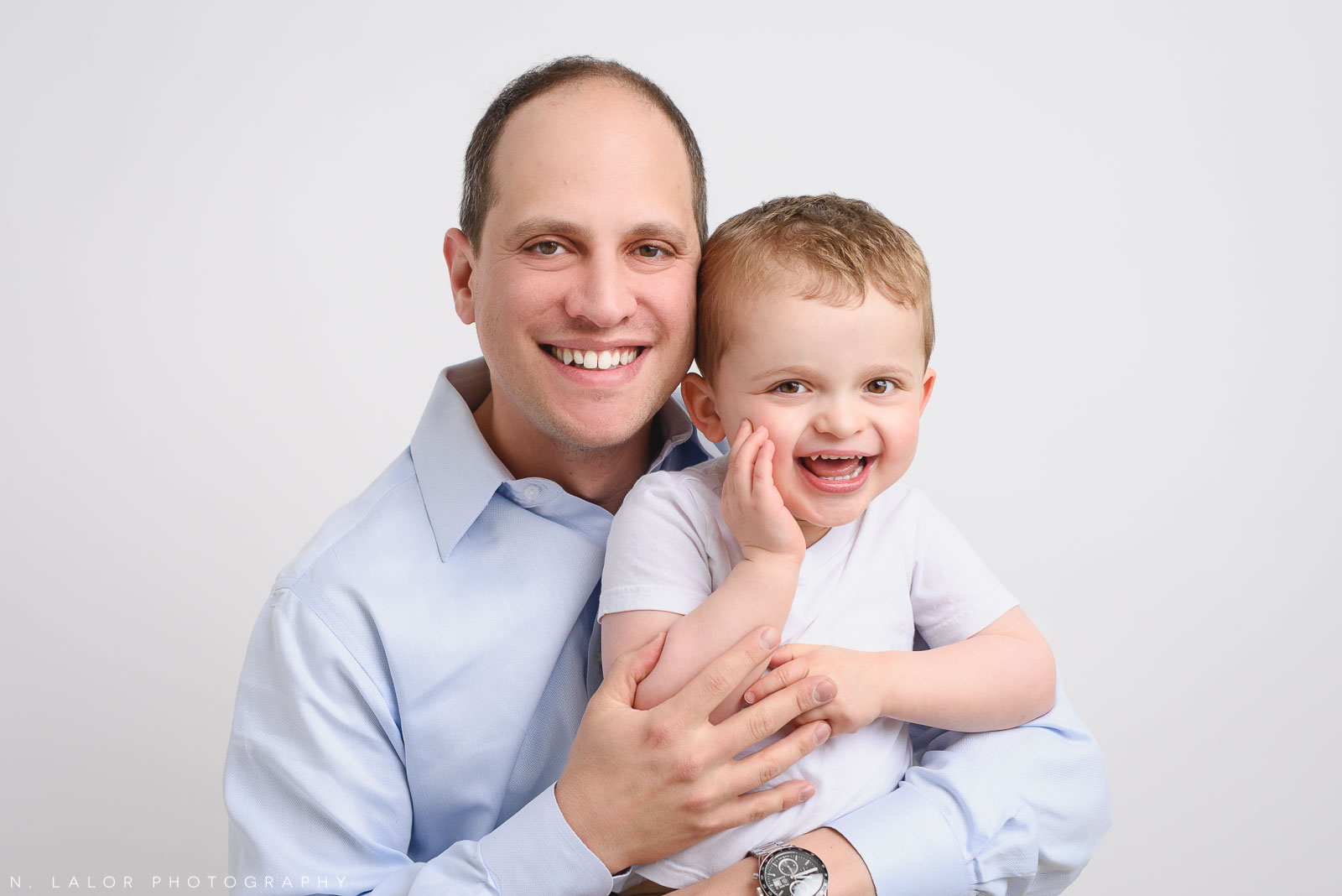 Dad with his son. Studio family photo session with N. Lalor Photography in Greenwich, Connecticut.