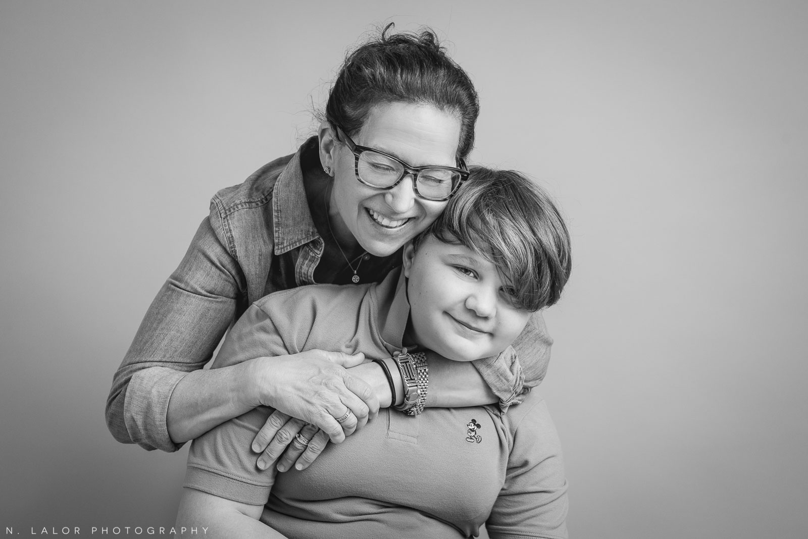 Mom with her son. Teen family photo session with N. Lalor Photography. Greenwich, Connecticut studio photographer.