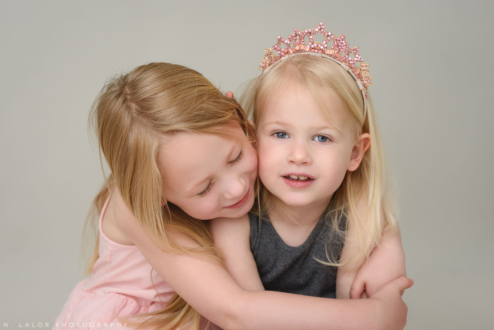 Sisters. Family photo session with N. Lalor Photography. Greenwich, Connecticut studio photographer.