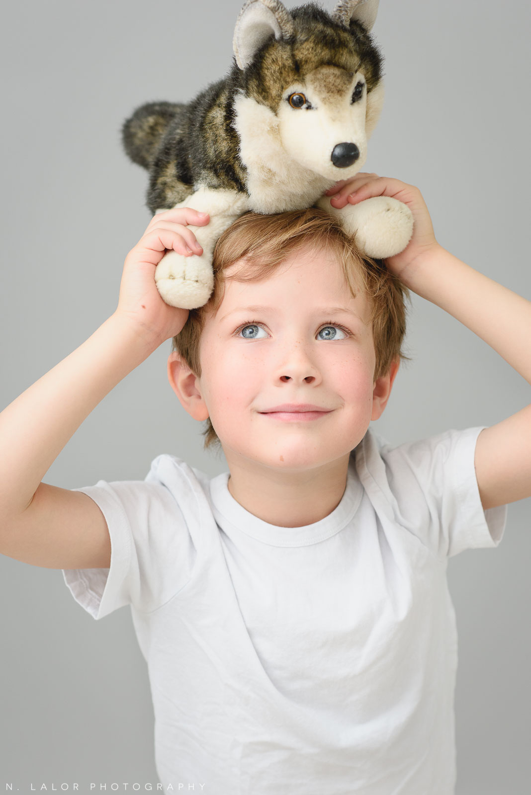 A boy and his favorite toy. Simple studio portrait session with N. Lalor Photography in Greenwich, CT.