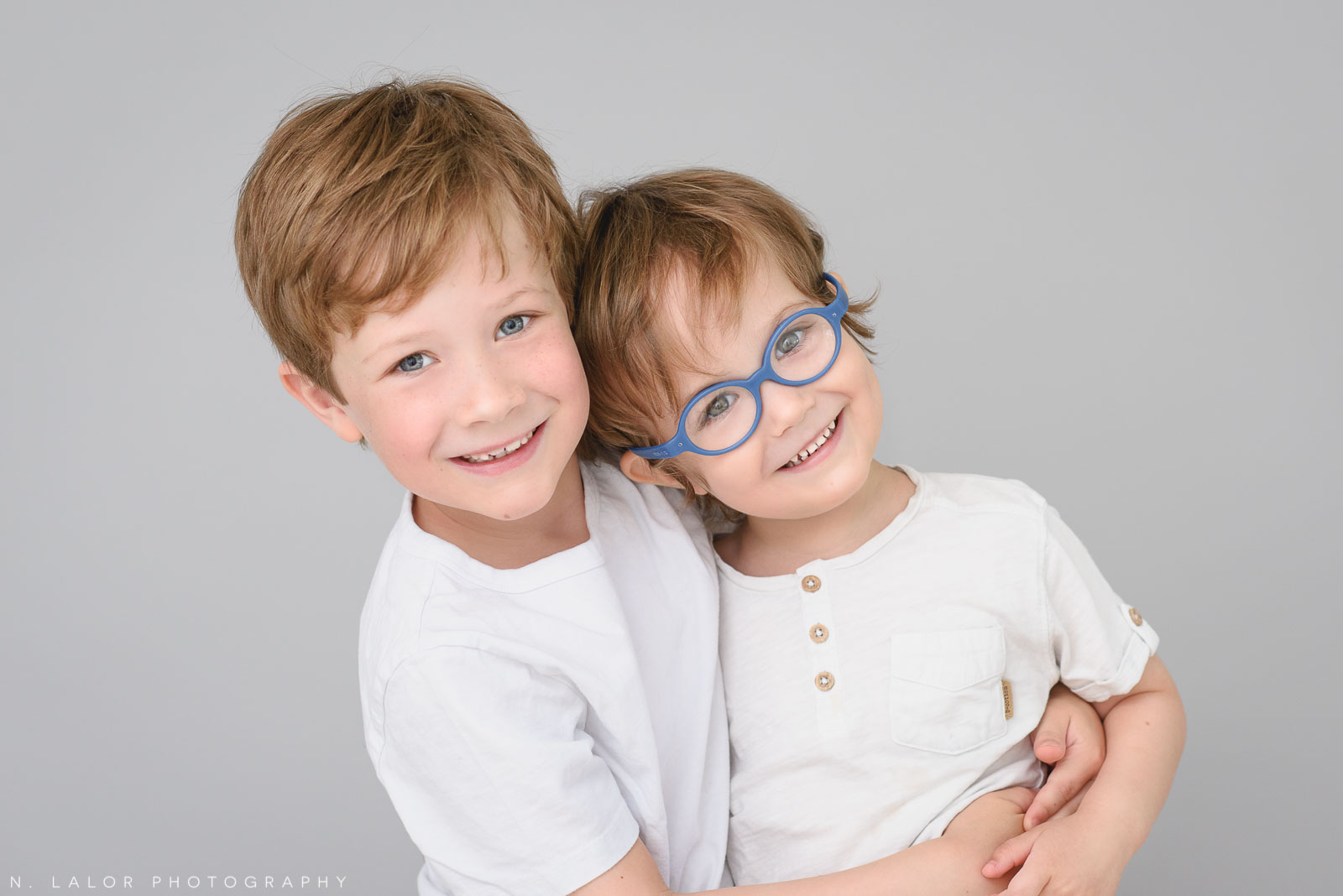 The perfect brother pose. Simple studio portrait session with N. Lalor Photography in Greenwich, CT.