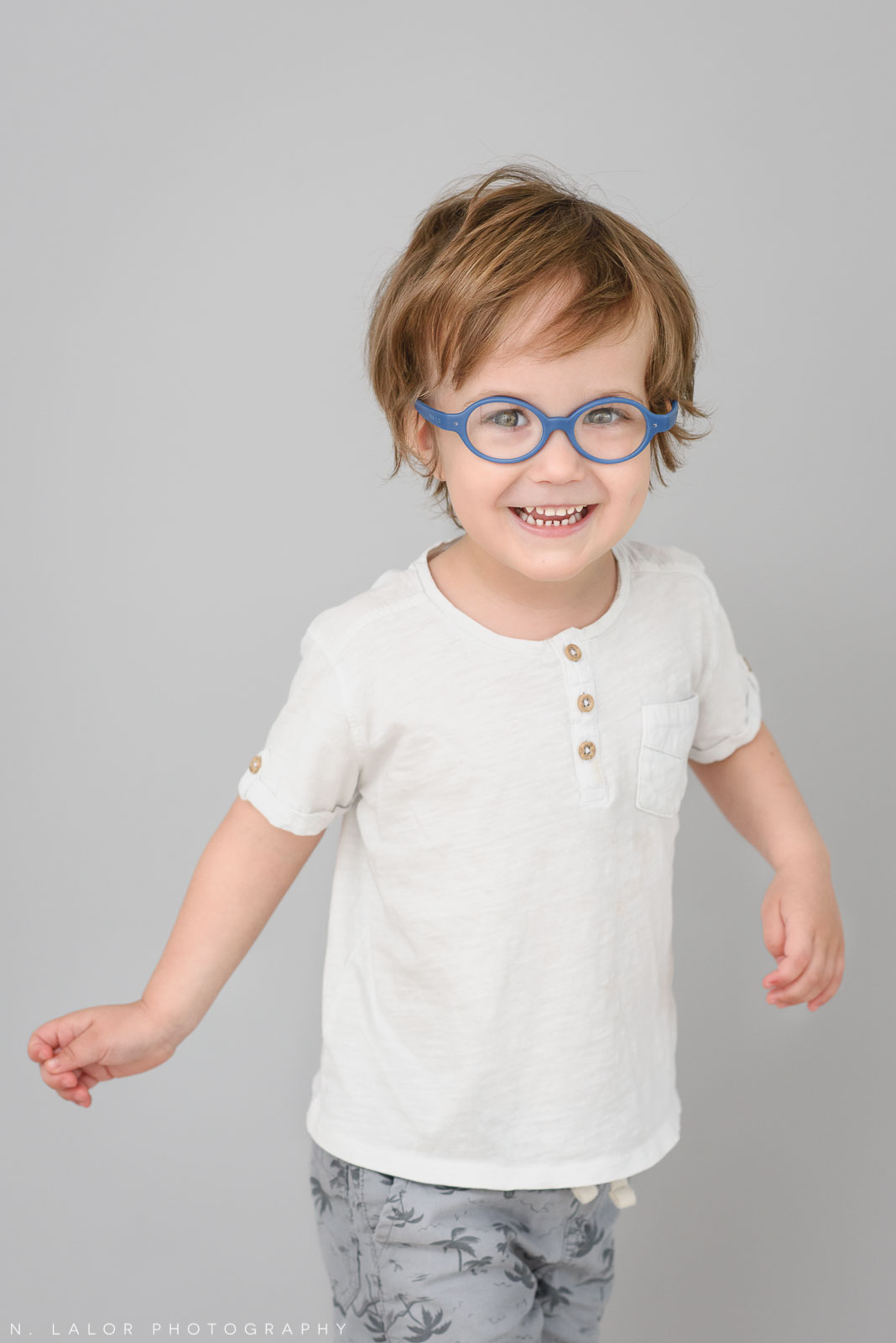3-year old with glasses. Simple studio portrait session with N. Lalor Photography in Greenwich, CT.