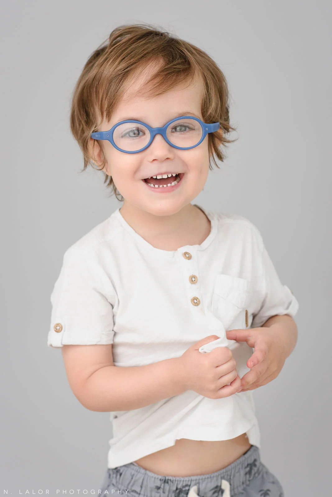 Laughing 3-yr old. Simple studio portrait session with N. Lalor Photography in Greenwich, CT.