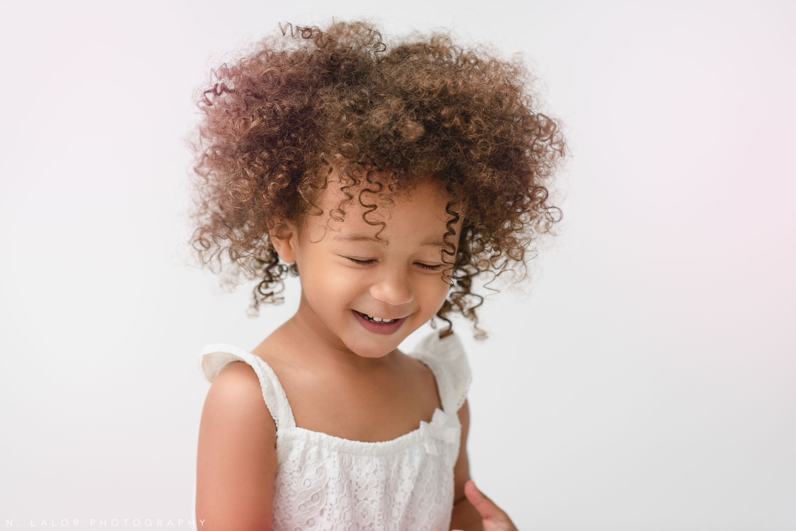 Giggles. Studio portrait session with N. Lalor Photography in Greenwich, Connecticut.