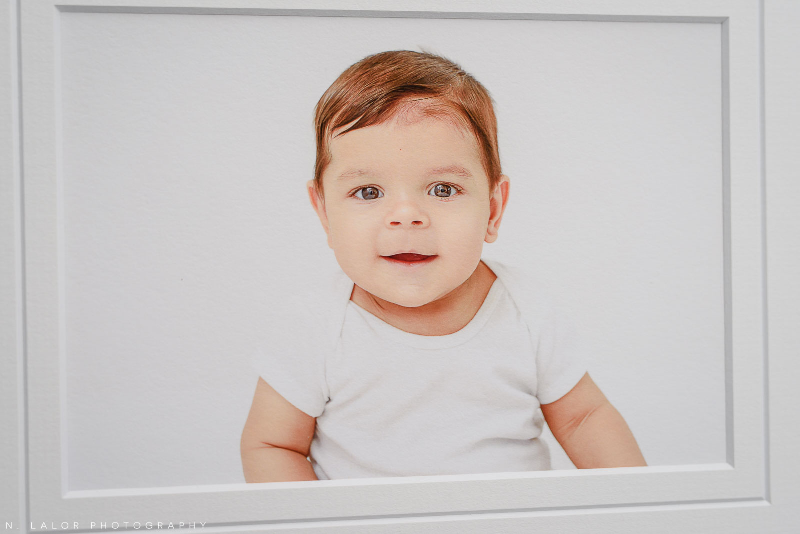 Closeup portrait. Studio baby photo session with N. Lalor Photography. Greenwich, Connecticut.