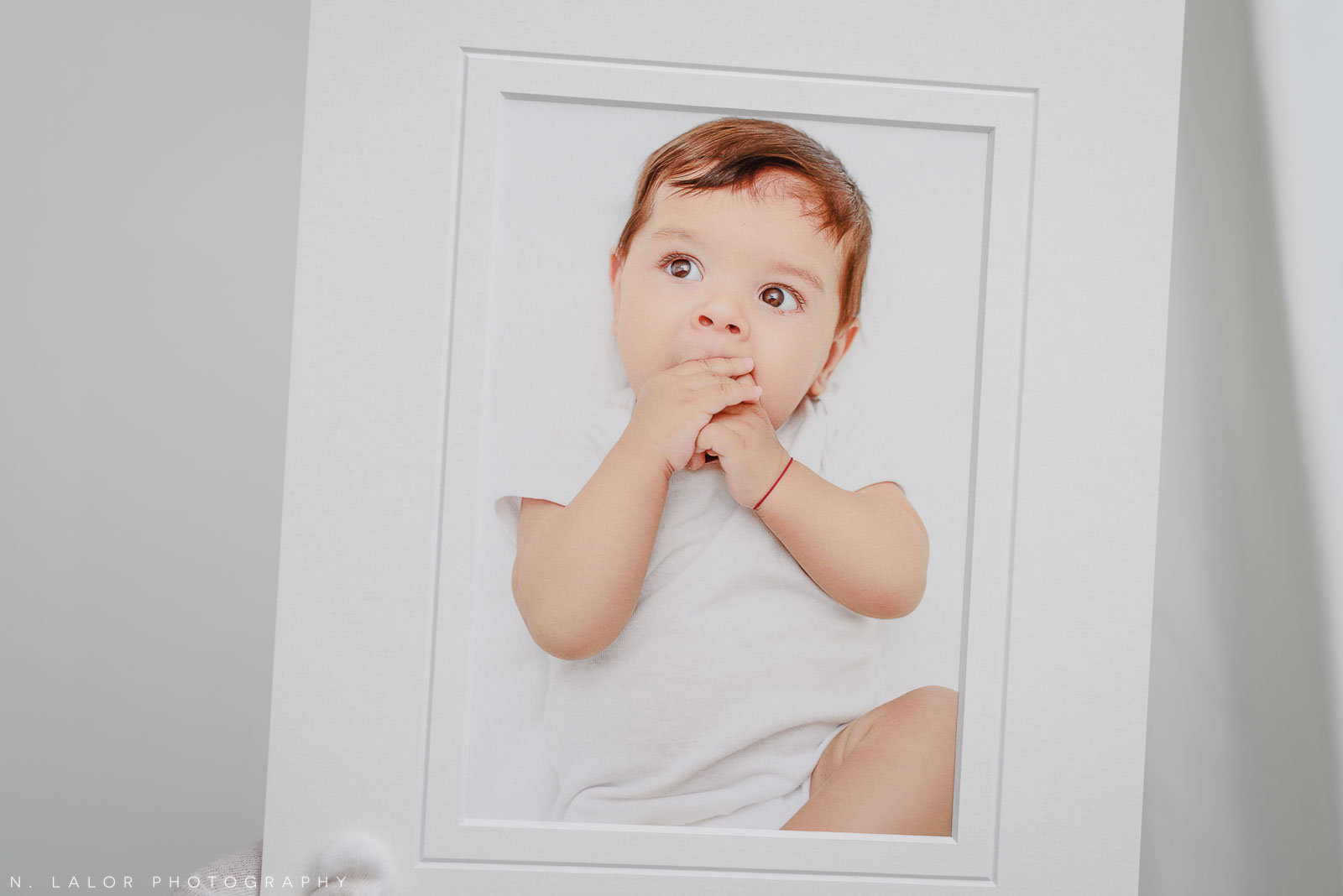 Matted fine art print. Studio baby photo session with N. Lalor Photography. Greenwich, Connecticut.
