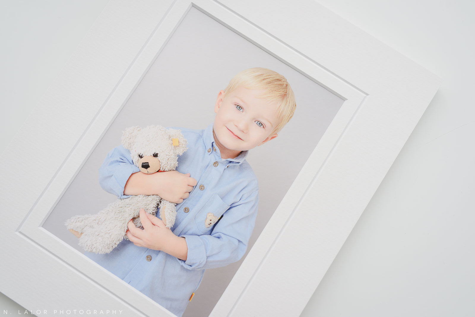 Henry with his favorite toy. Family portrait session with N. Lalor Photography in Greenwich, Connecticut.