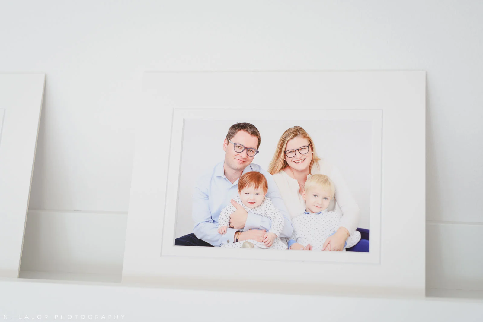 Fine art print of the family. Family portrait session with N. Lalor Photography in Greenwich, Connecticut.