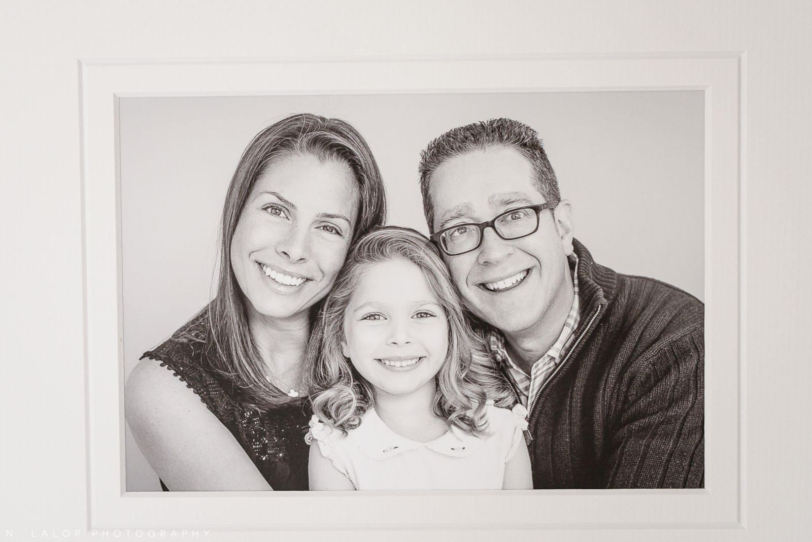 Mom and Dad with daughter - fine art print. Family photoshoot by N. Lalor Photography in Greenwich, Connecticut.