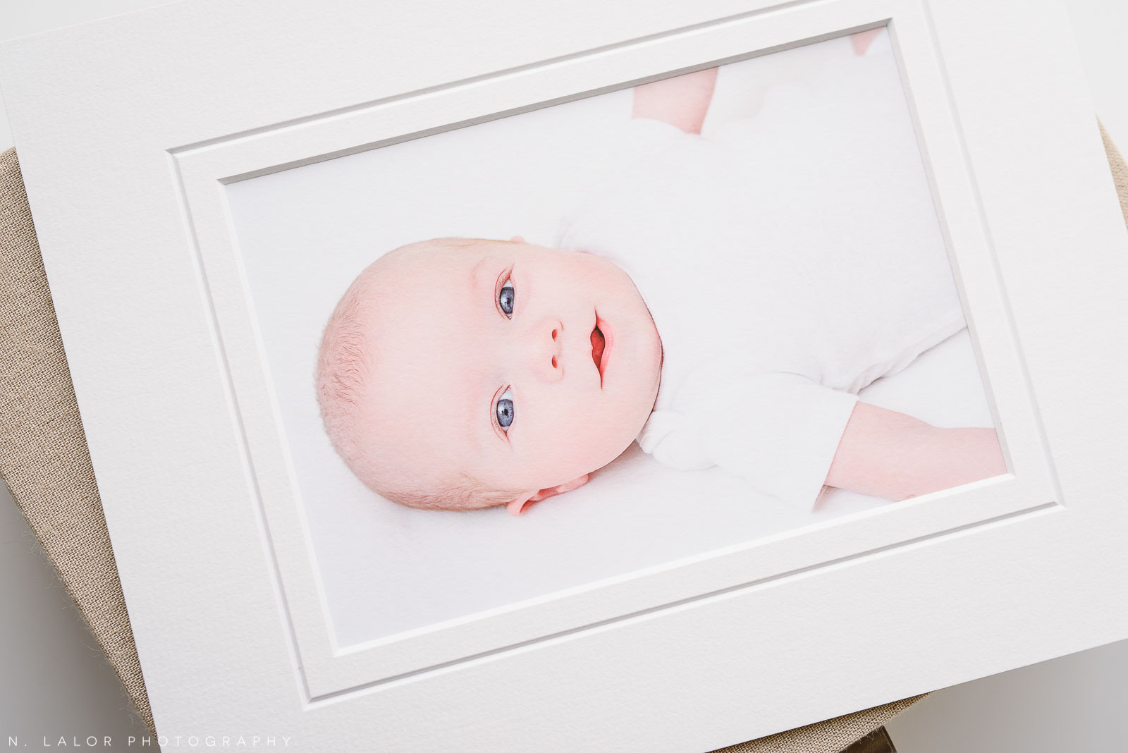 Baby face closeup. Twin newborn photo session by N. Lalor Photography. Greenwich, Connecticut.