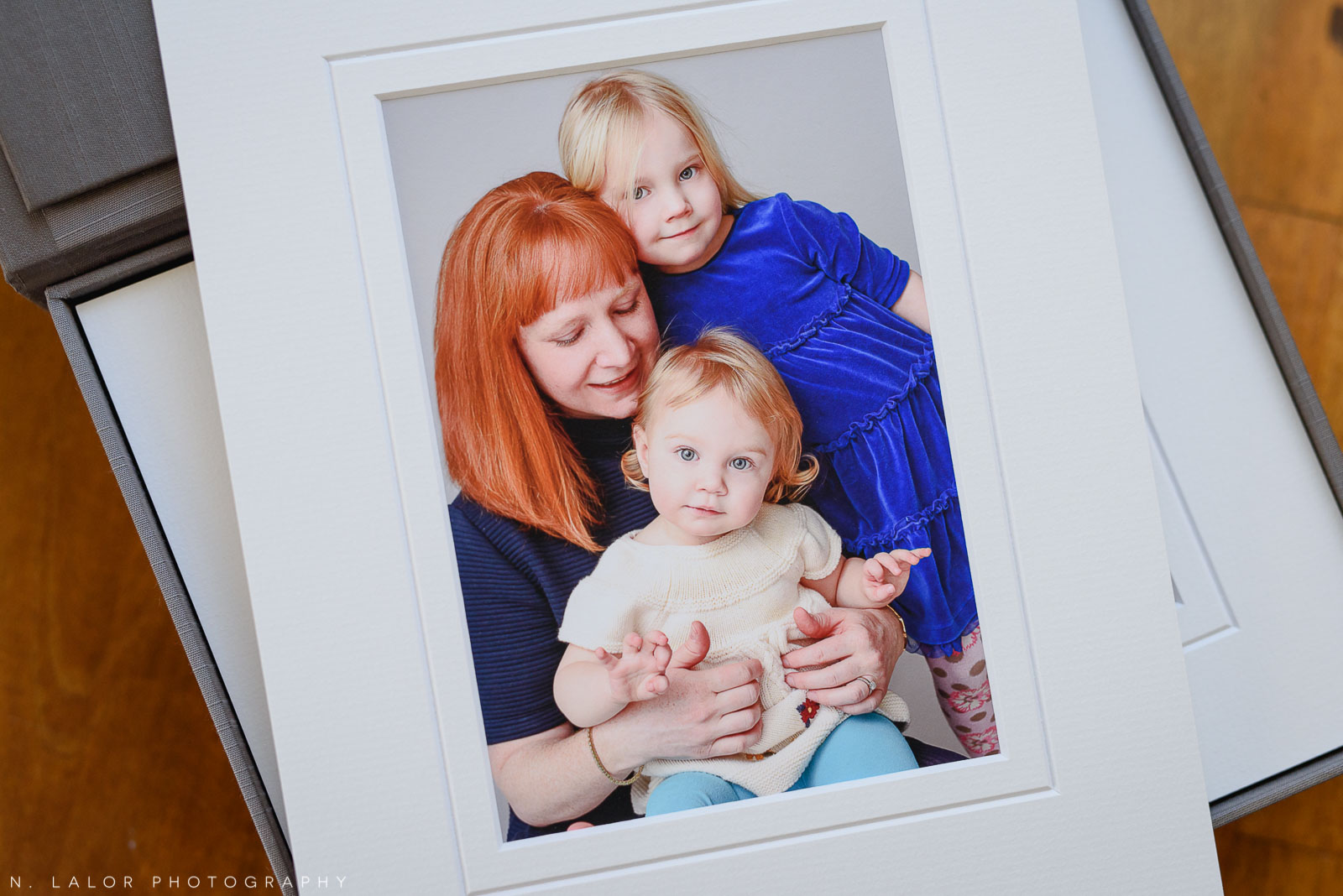 Mom with her daughters. Family portrait session with N. Lalor Photography in Greenwich Connecticut.