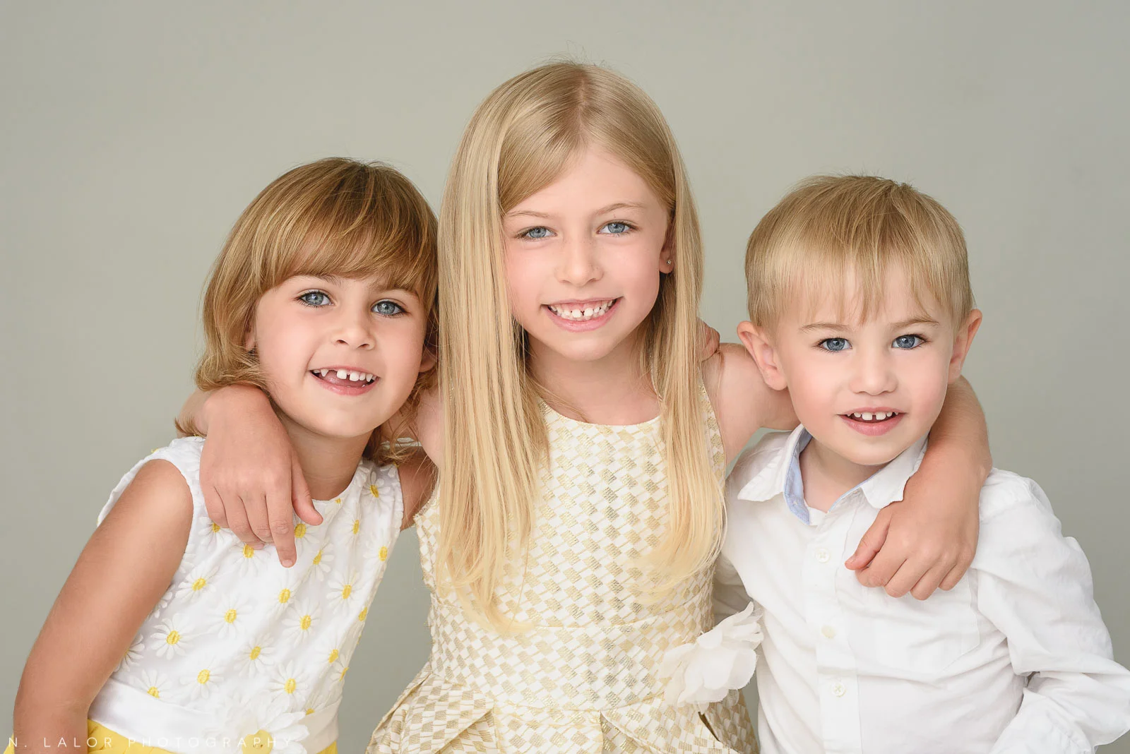 These 3 kids did NOT all have perfect smiles at the same time.. this one is a combination of two images.