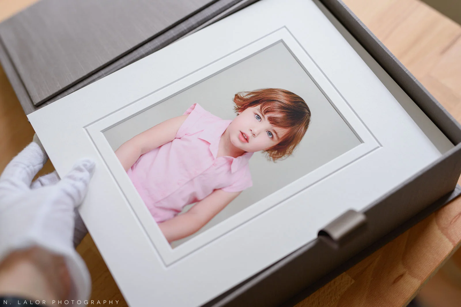 The final step, placing finished photograph into a handmade heirloom box for the client.