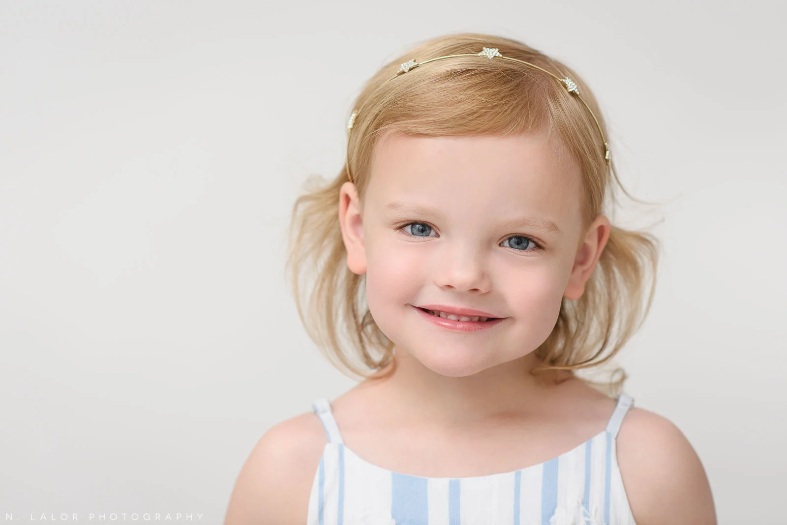 Close up portrait of a preschool-aged girl. Studio portrait by N. Lalor Photography. Greenwich, Connecticut.