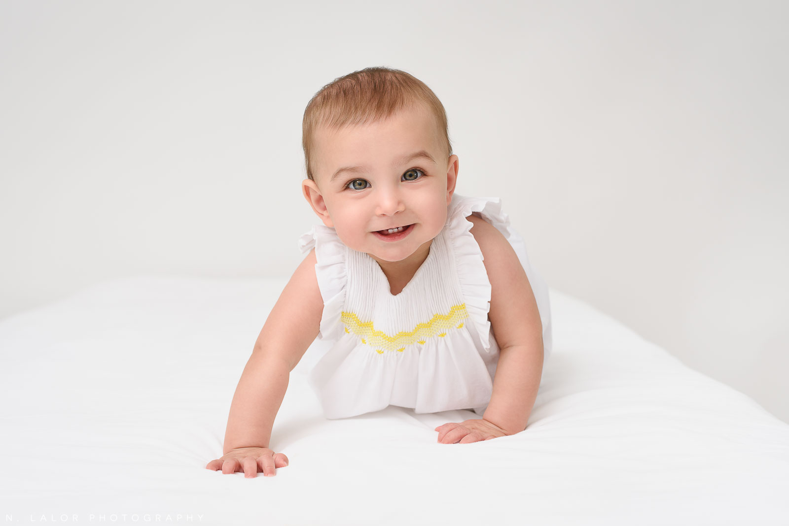 Crawling. Portrait by N. Lalor Photography in Greenwich Connecticut.