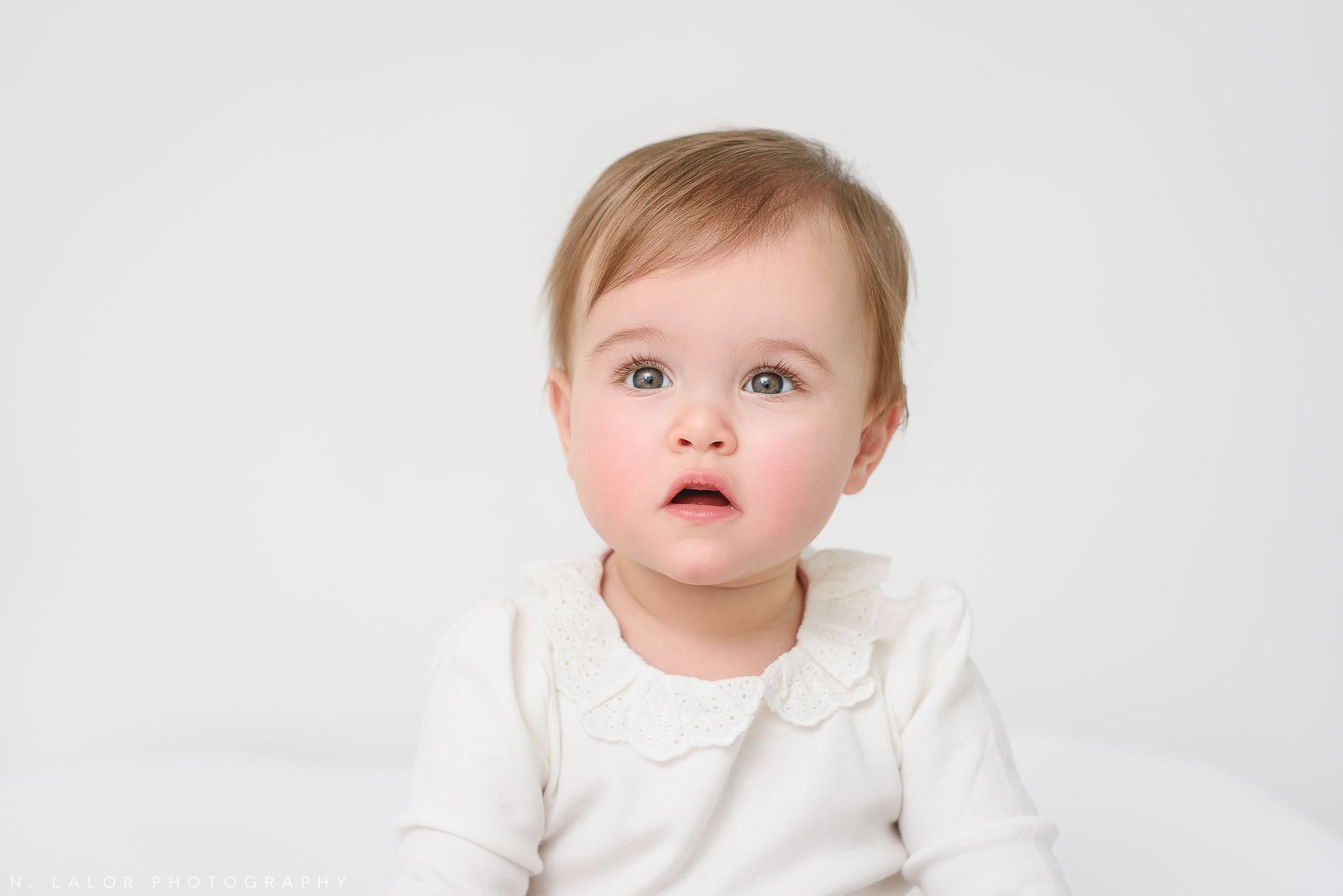 Baby girl. Portrait by N. Lalor Photography in Greenwich Connecticut.