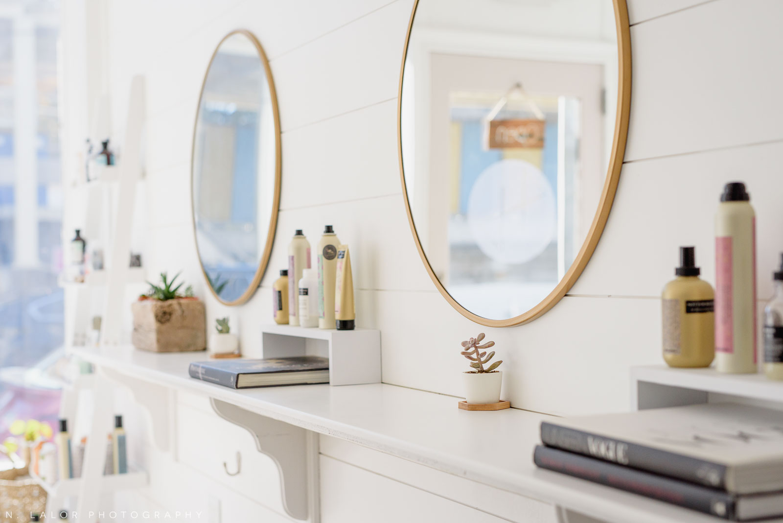 Haus of Pretty interior, round mirrors and art books. Photo by N. Lalor Photography.