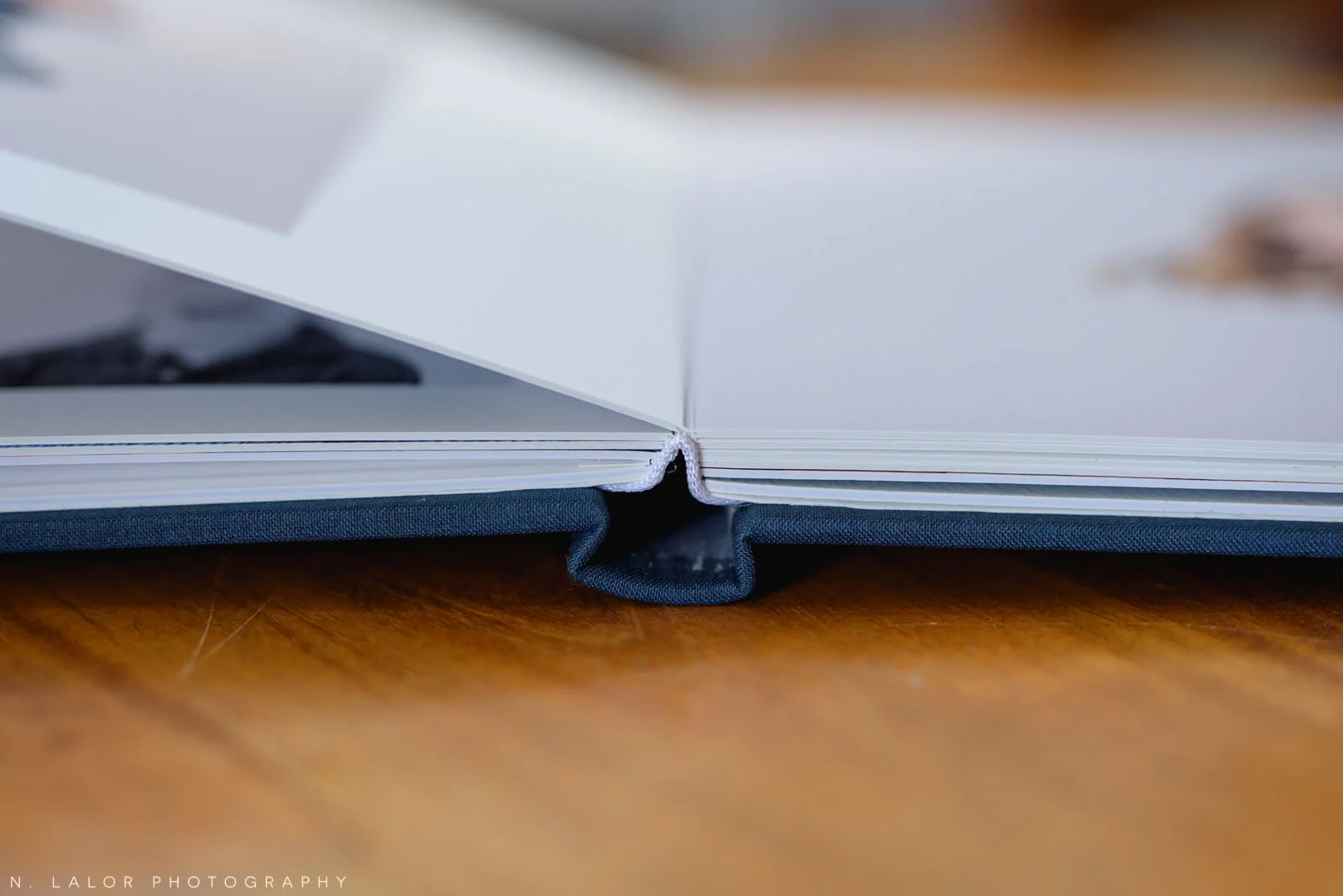 Image of the Album detail, showing the spine and page construction. Images by N. Lalor Photography, Greenwich Connecticut.