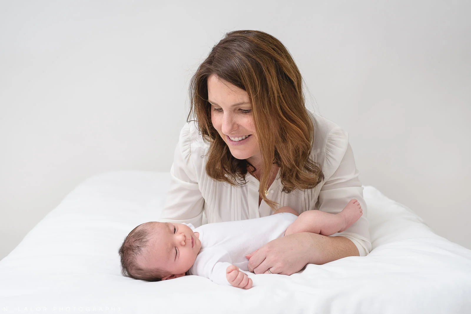 Image of a Mother and her baby boy. Studio portrait by N. Lalor Photography in Greenwich, Connecticut.