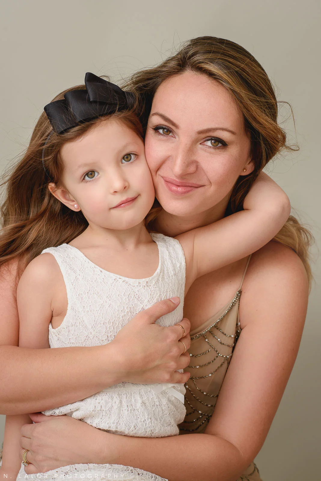 Glamour portrait of a Mom and daughter. Studio photograph by N. Lalor Photography in Greenwich Connecticut.