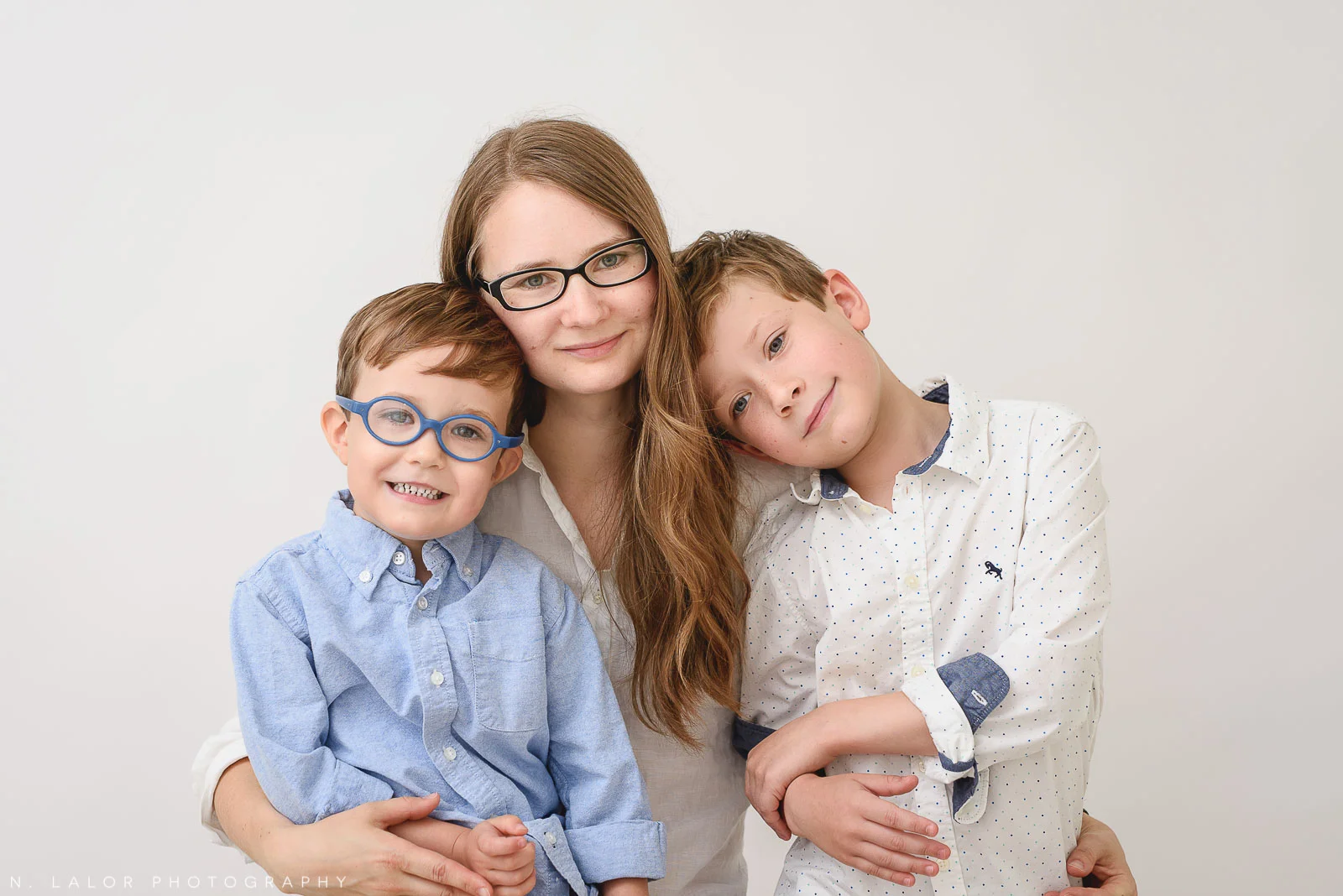 Self portrait of Nataliya Lalor with her two boys. Studio portrait by N. Lalor Photography in Greenwich, Connecticut.