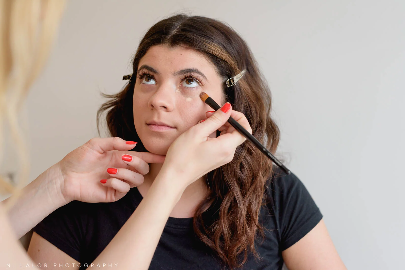 Applying under eye concealer. Photo by N. Lalor Photography, makeup tips by Haus of Pretty of Westport CT.