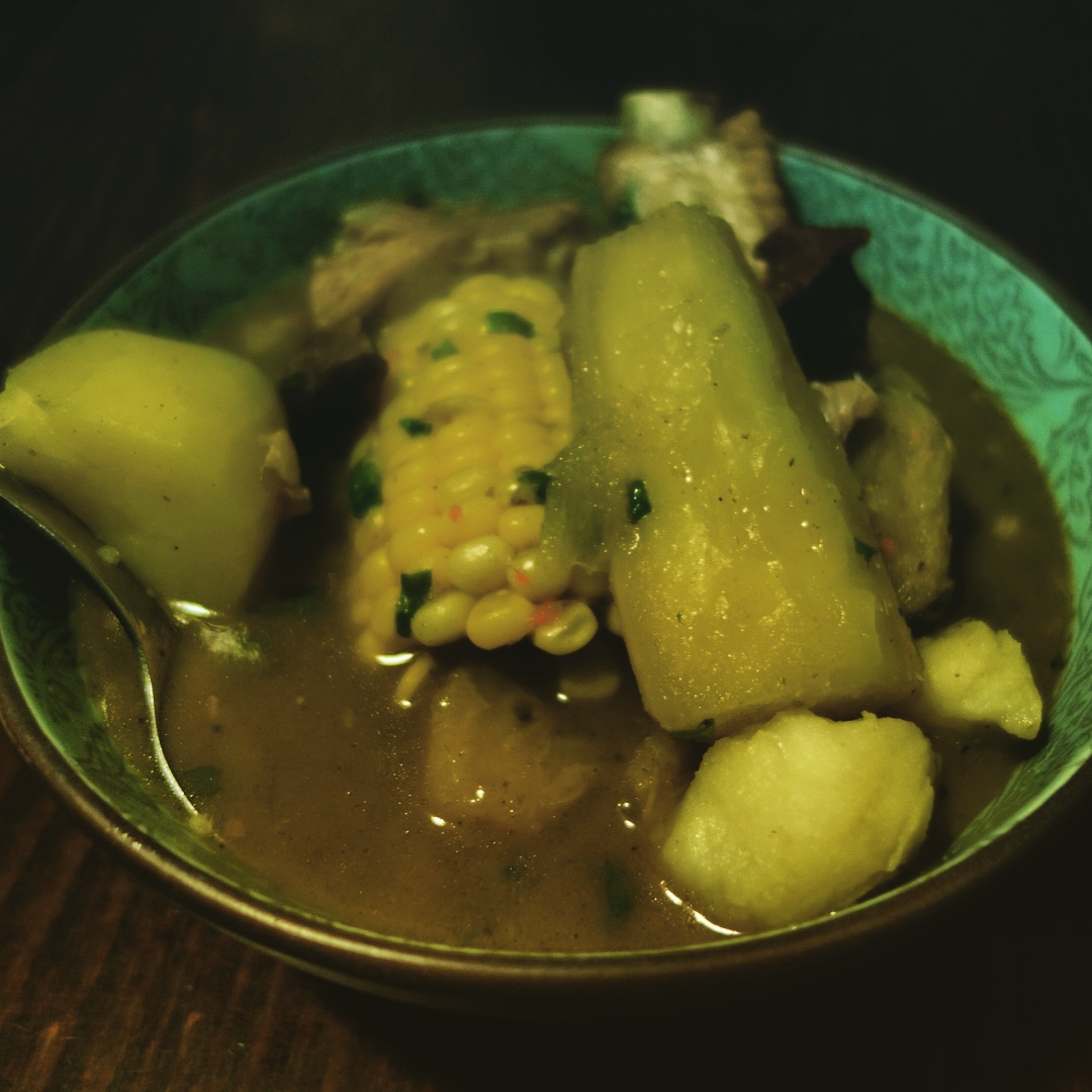 Sancocho, a typical Colombian soup made with beef, pork, yucca, potatoes, plantains and corn.