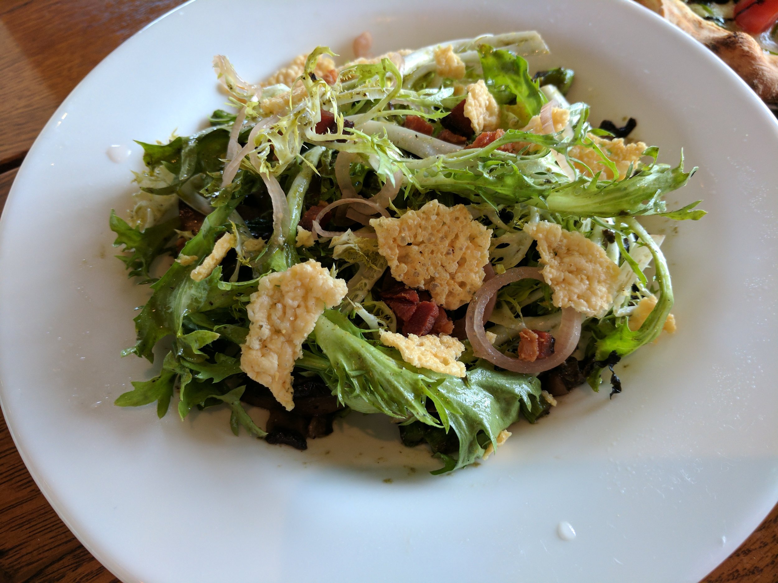 Grilled asparagus with mushrooms, frisee, red onion and parmesan crisps.