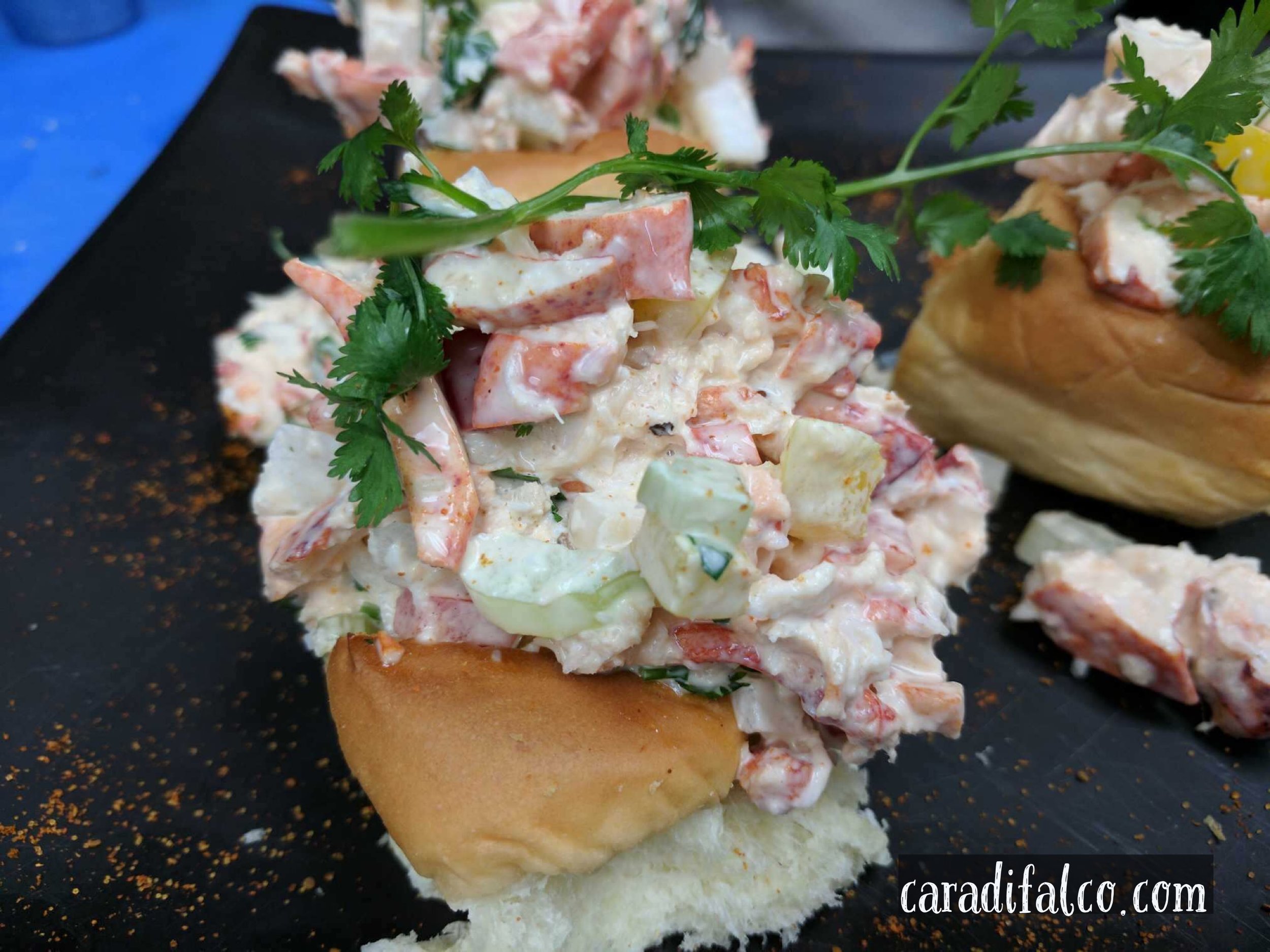 Langosta Lounge serves theirs as sliders, but you can make it a full roll! 