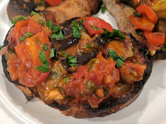 Caponata is a traditionally Sicilian dish of roasted eggplant, peppers and tomatoes. 