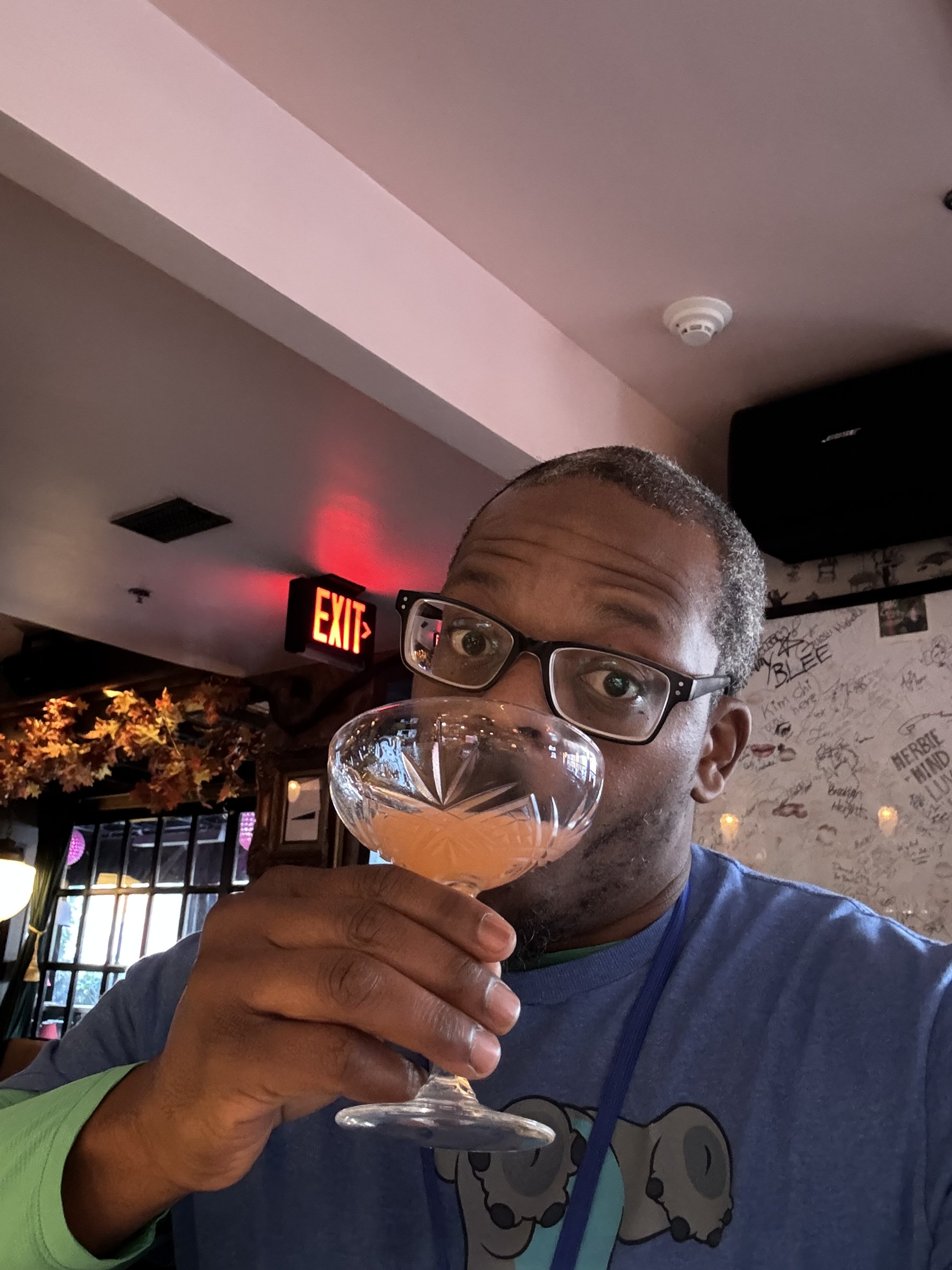 Kwame having a cocktail at Little Gay Pub