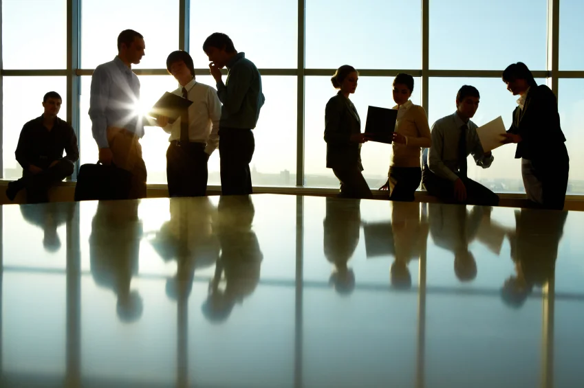 iStock_000012204568Smallgroupbehindtableinfrontofwindow.jpg