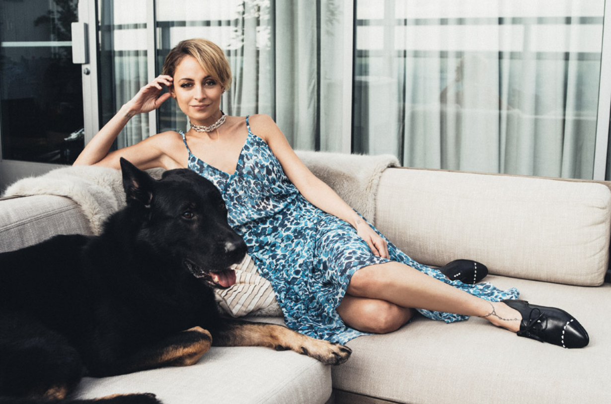 Nicole Richie lounging at her workspace Hills Penthouse in West Hollywood, wearing Sarah Flint Gravati oxfords, House of Harlow 1960 x Revolve dress and a Jennifer Fisher necklace.