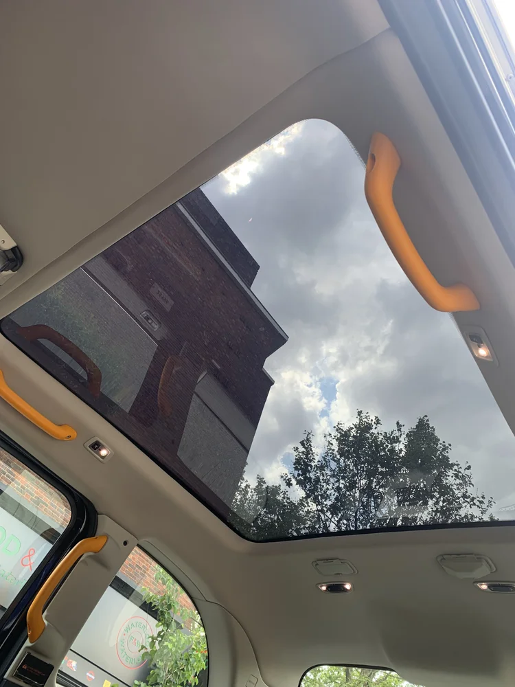 Panoramic glass roof of electric black cab
